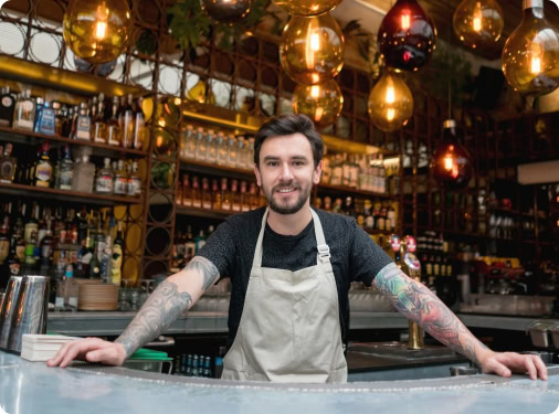Bartender smiling after receiving his ice delivery